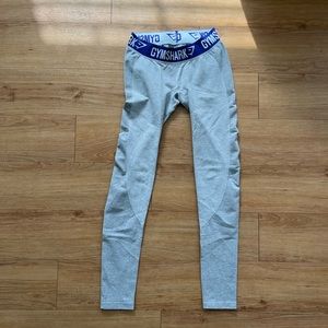 Lightly worn GYMSHARK grey leggings with purple waistband. size Small